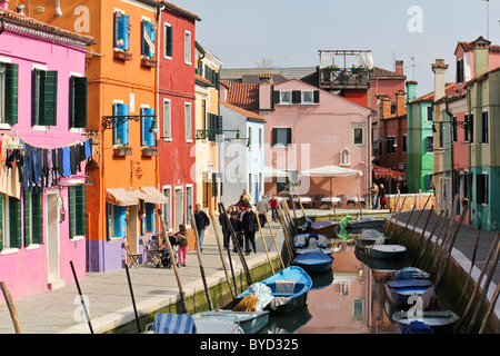 Moored boats on canal in Burano, Venice Italy. Stock Photo