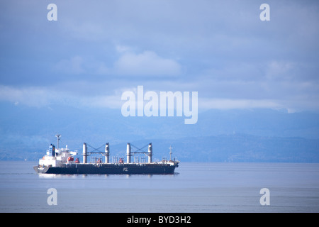 A ship sails in the Juan de Fuca Strait. Stock Photo