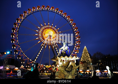 Christmas market with a ferris wheel at the Neptune Fountain, Alexanderplatz, Berlin, Germany, Europe Stock Photo