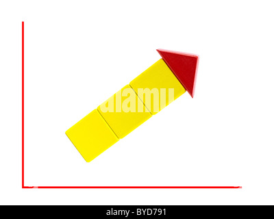Toy blocks in the shape of an arrow on a line graph Stock Photo