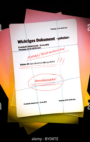 Papers, lettering 'Wichtiges Dokument', German for 'important document', symbolic image for secret documents Stock Photo