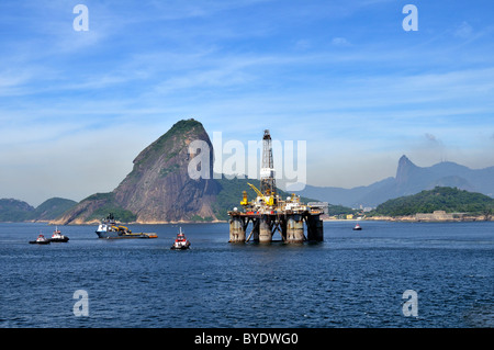 Oil rig of the Brazilian oil company Petrobras passing Sugarloaf Mountain, Bahia de Guanabara Bay, Rio de Janeiro, Brazil Stock Photo