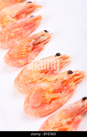 cooked iced prawns, defrosting before being eaten. Stock Photo