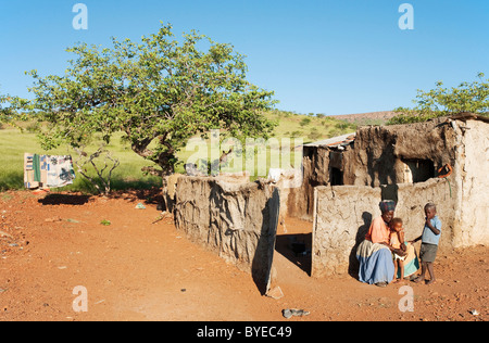 Modest home of a Damara family in the Damaraland with unusual green scenery after heavy rainfalls at the end of the rainy season Stock Photo