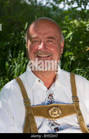 Elderly man wearing traditional Bavarian lederhosen, portrait Stock Photo
