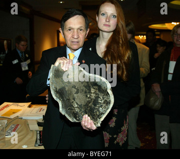 Dennis Kucinich and wife Elizabeth (they are holding a mortar shell they brought back from Lebanon) The Democrats Winter Stock Photo