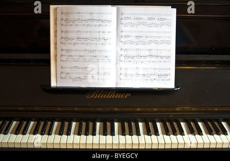 Sheet music on an upright piano Stock Photo