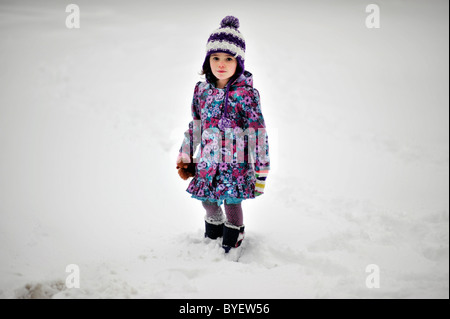 four years old girl in snow Stock Photo