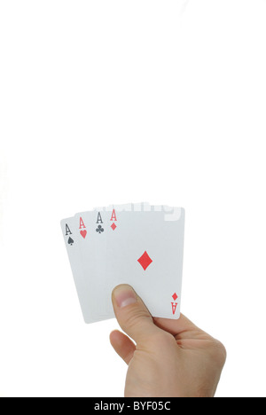 Four aces in a hand isolated on a white background. Stock Photo