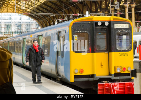 London , Liverpool Street Station , National Express train arrives at platform Stock Photo