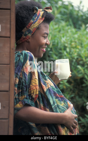 pregnant african woman drinking milk Stock Photo