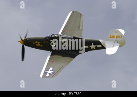 Bell P-39Q Airacobra in USAAF colours makes a banking flypast at Duxford Flying Legends Airshow Stock Photo