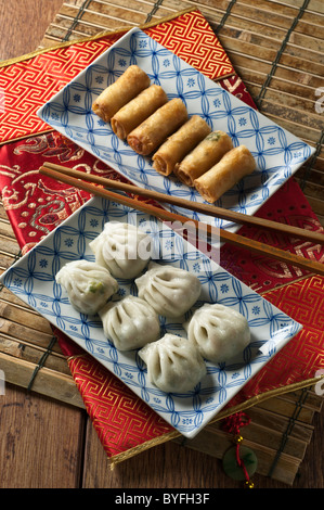 Steamed dumplings and spring rolls. Dim sum. Stock Photo