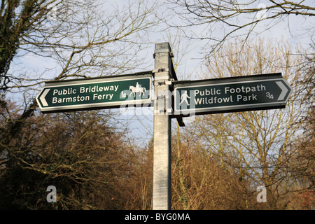 A galvanised steel post supporting a metal footpath and bridleway sign in Washington, North East England, UK Stock Photo