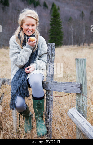 Portrait of teenage girl wearing scarf in field Stock Photo