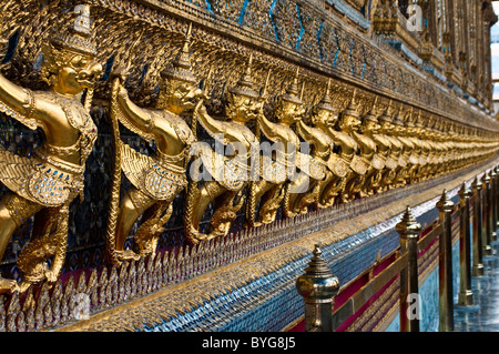 Figures decorating Colonnaded corridor of the Temple of Emerald Buddha, Wat Phra Kaeo, Grand Palace, Bangkok, Thailand Stock Photo