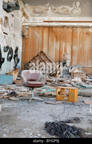 Abandoned vinyl records pressing factory. Dusty reel audio tape on the floor. Stock Photo