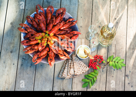 Meal with crayfishes on outdoor table Stock Photo