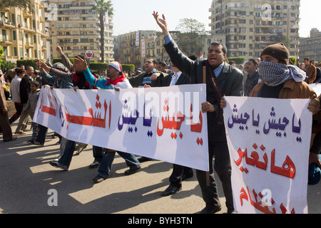 anti-government protestors with sign calling for the army to change the regime, Tahrir Square, Cairo, Egypt Stock Photo