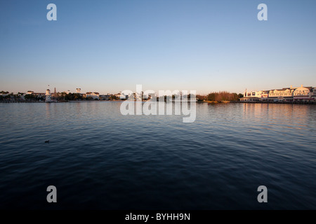 Lake surrounded by a boardwalk a the the Swan and Dolphin resorts at sunset in Disney World Orlando Florida. Stock Photo