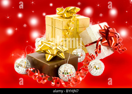 Christmas gifts - three colorful gift-boxes with ribbons and decorations Stock Photo