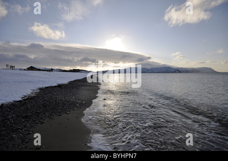 West shore Llandudno  winter coastal scene looking towards Conwy Mountain Stock Photo