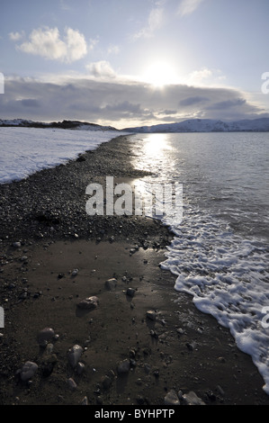 West shore Llandudno  winter coastal scene looking towards Conwy Mountain Stock Photo