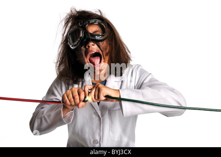 Young girl in laboratory gear being shocked by electricity isolated over white background Stock Photo