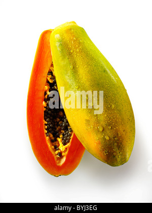 Fresh Formosa papaya cut, against a white background as a cut out Stock Photo