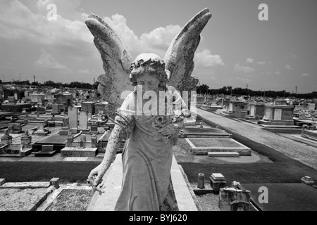 USA, Louisiana, New Orleans, Marble Angel statue atop mausoleum in Greenwood Cemetery Stock Photo