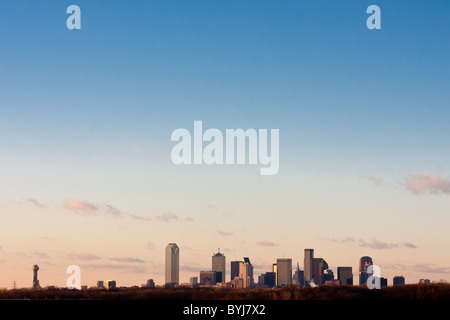 Wide angle view of Dallas, Texas skyline from the south at the I-45 Interstate bridge over the Trinity River in late afternoon. Stock Photo