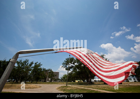 USA, Mississippi, Biloxi, American flag flies from bent flagpole is memorial to victims of Hurricane Camille in 1969 Stock Photo