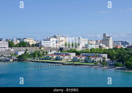 Puerto Rico view of Old San Juan old city wall and colorful historic buildings as seen from arriving caribbean cruise ship Stock Photo