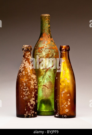 Three dirty old bottles Stock Photo