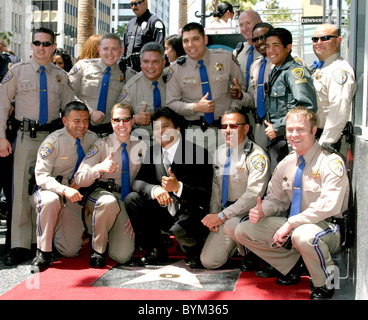 Erik Estrada and Officers from the California Highway Patrol Erik Estrada receives a Star on the Hollywood Walk of Fame on Stock Photo