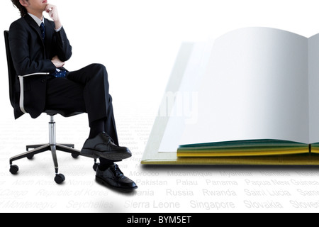 Businessman Sitting Chair Hand On Chin Open Book Stock Photo