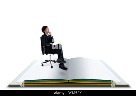 Businessman Sitting Chair Hand On Chin Open Book Stock Photo
