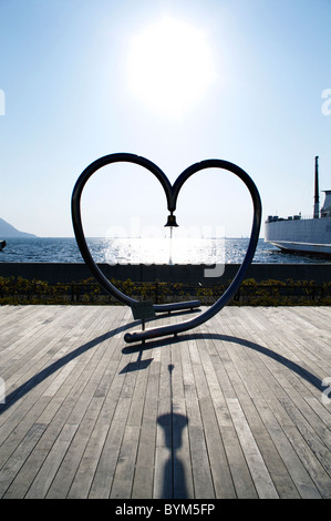 Heart Shape Sculpture Bell Boardwalk Sea Stock Photo