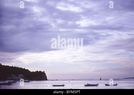 Boats Moored in Sea Stock Photo