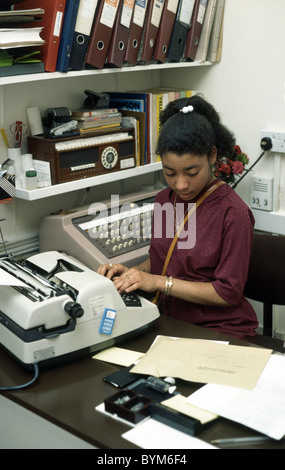 Secretary in the early 70's using an electric type writer Stock Photo