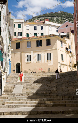 Typical traditional Gibraltar street / streets / road, with steep large / flight of stares leading up the hill towards The Rock. Stock Photo