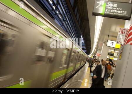 Commuters on the Japan Railways JR Yamanote train line, in Tokyo, Japan.