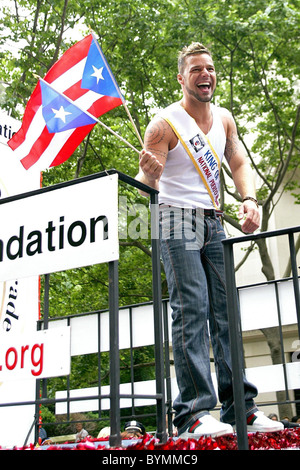 Ricky Martin, smiles as he waves his flags during The 50th annual National Puerto Rican Day parade along 5th Avenue New York Stock Photo