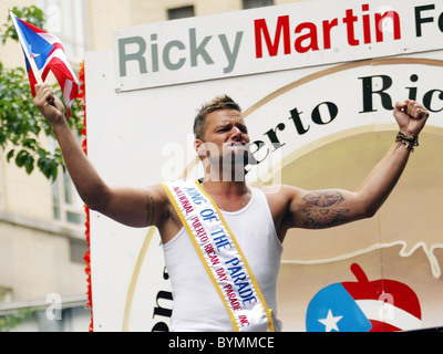 Ricky Martin, smiles as he waves his flags during The 50th annual National Puerto Rican Day parade along 5th Avenue New York Stock Photo