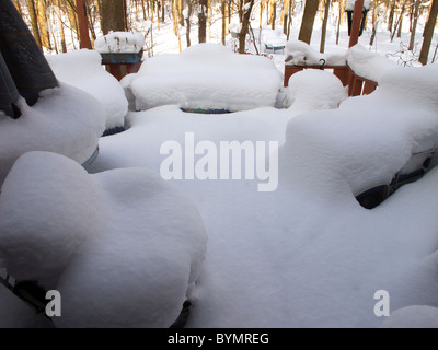 Snow covered lawn furniture on deck. Stock Photo