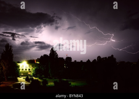 Lightning during night thunderstorm. on city Stock Photo