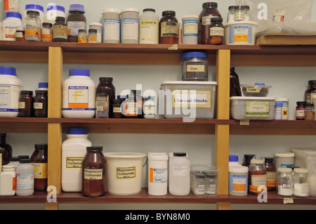 Shelves of assorted chemicals in a school chemical storage room in England. Stock Photo