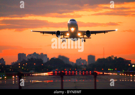 jet commercial airplane taking off the Jorge Newbery Airport, at sunset. Stock Photo