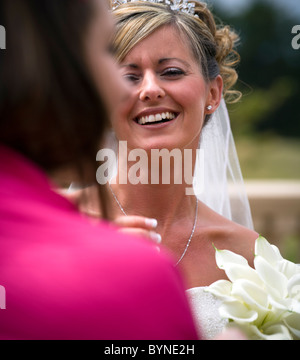 LAUGHING BRIDE AND A FRIEND Stock Photo
