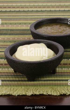 delicious sour cream and salsa verde or tomatillo sauce made with hot peppers and fresh tomatillos Stock Photo